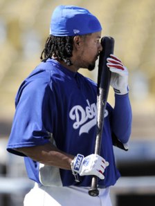 Manny snorting a line off his bat before a game